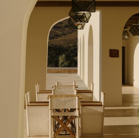 covered outdoor dining area with long table