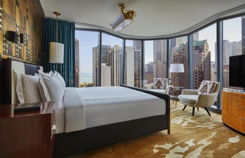 A suite at Viceroy Chicago with floor to ceiling windows and a beautiful view of Chicago