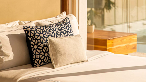 3 pillows on a bed in a suite at Viceroy Los Cabos