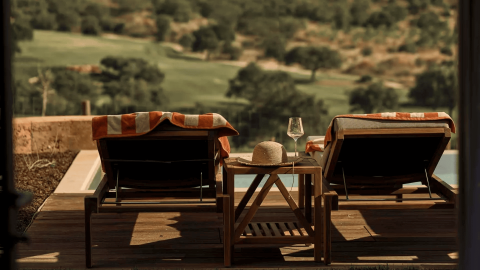 Two lounge chairs overlooking the pool at Ombria Algarve