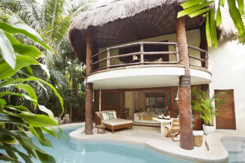 Exterior of a room at Riviera Maya with a private pool and lounge area