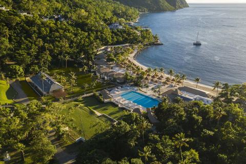 Overhead view of Viceroy Sugar Beach property with the ocean, pools, and green areas