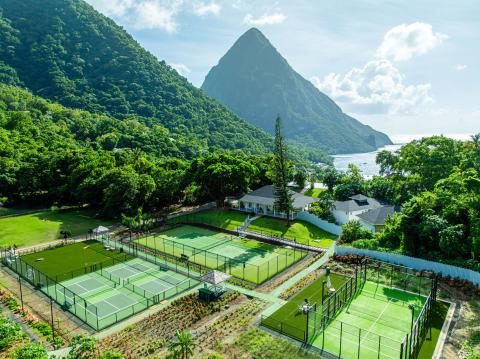 Three racquet courts and a view of the beautiful mountains at Viceroy Sugar Beach