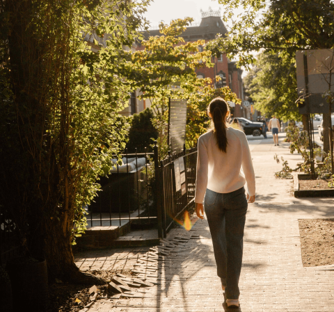 A woman walking down the street in Washington DC