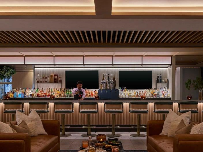 A bartender prepares a cocktail in the Viceroy Lounge at Viceroy Snowmass.