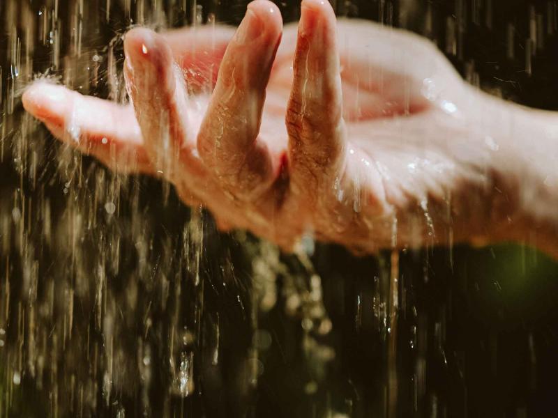 hand under falling water