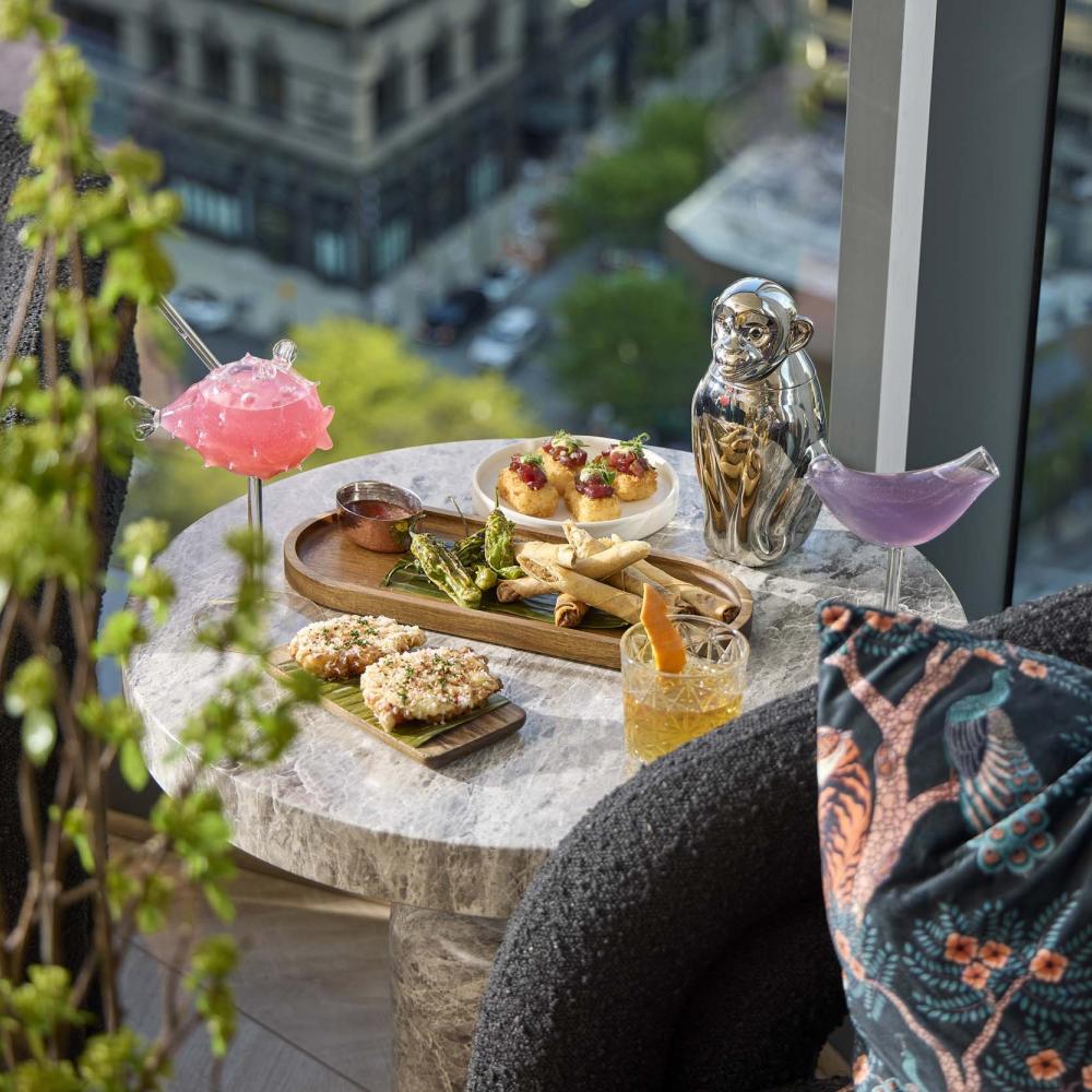 Drinks and snacks on an outdoor dining table