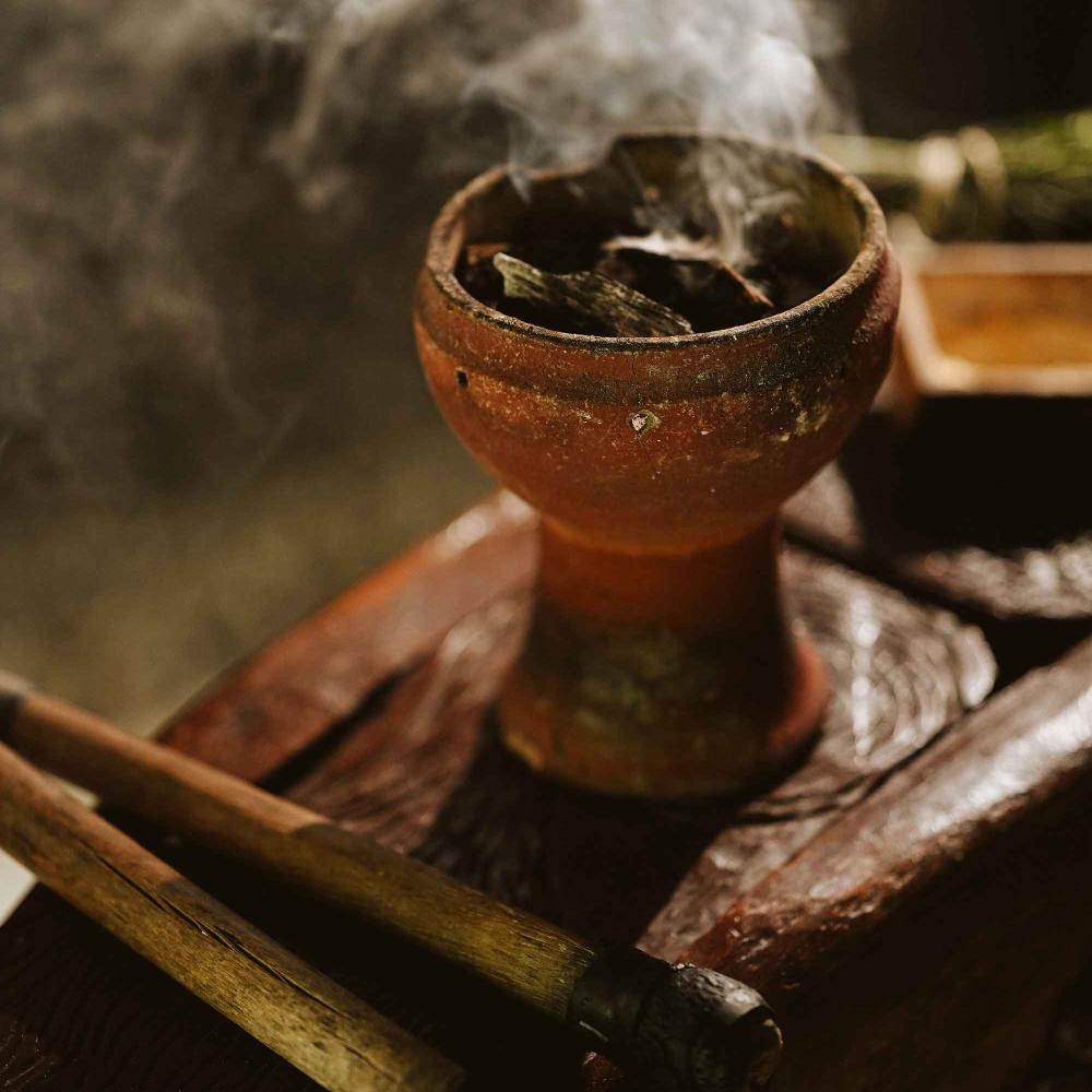 A smoking herb in a vessel at a spa experience