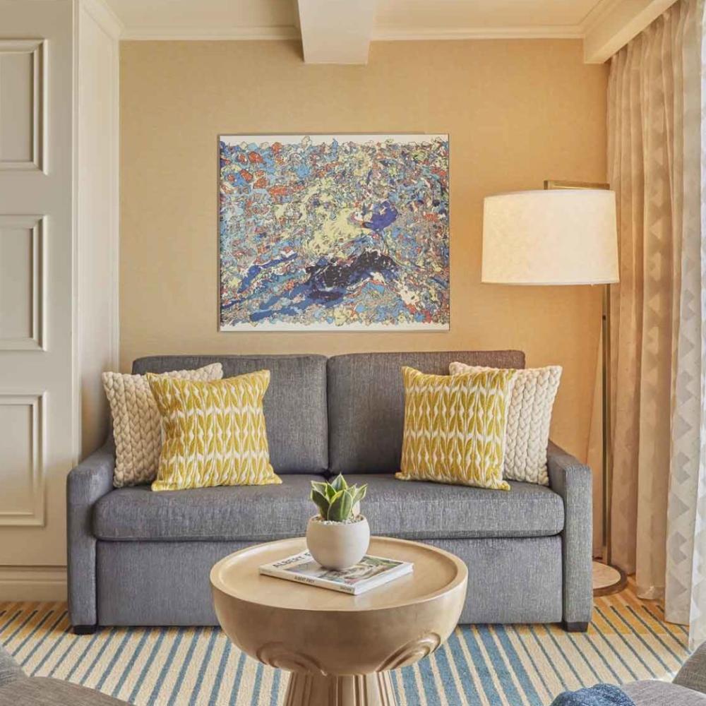A couch and coffee table in a junior suite at Viceroy Santa Monica