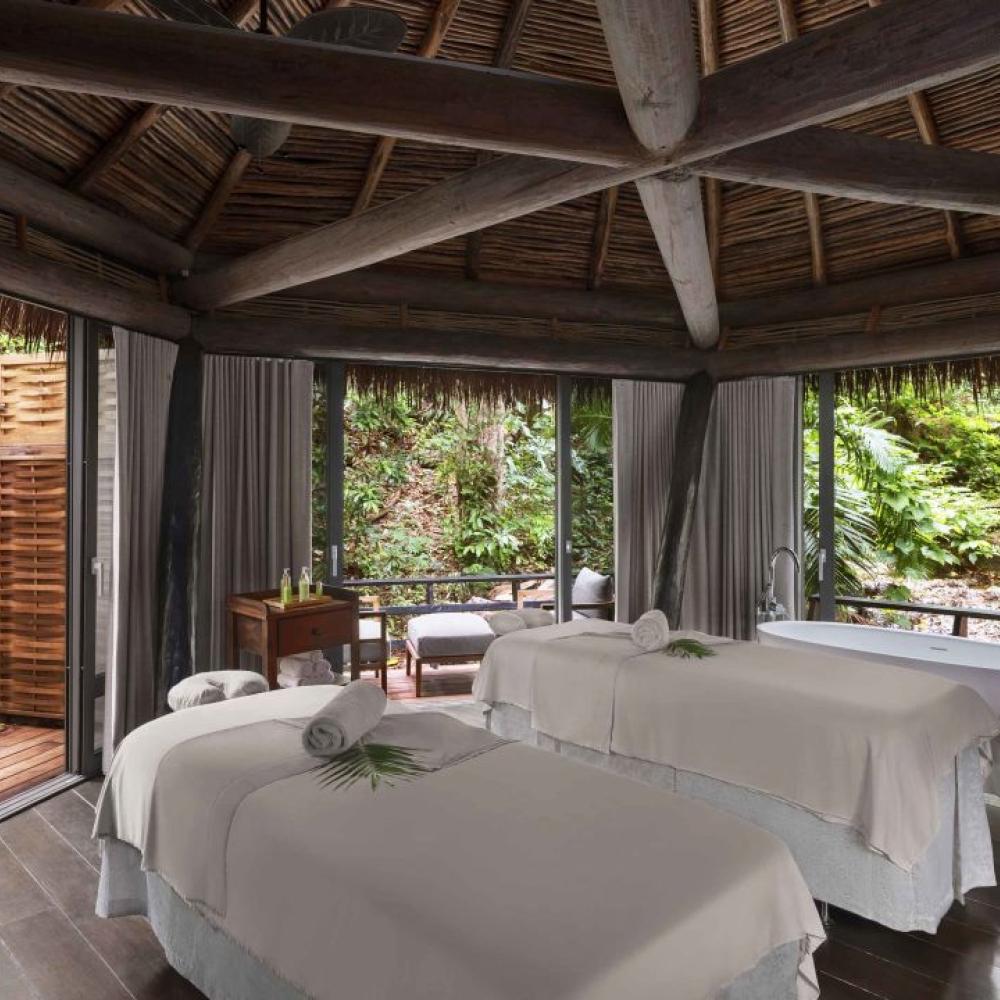 Two massage tables in an a spa hut at Viceroy Sugar Beach