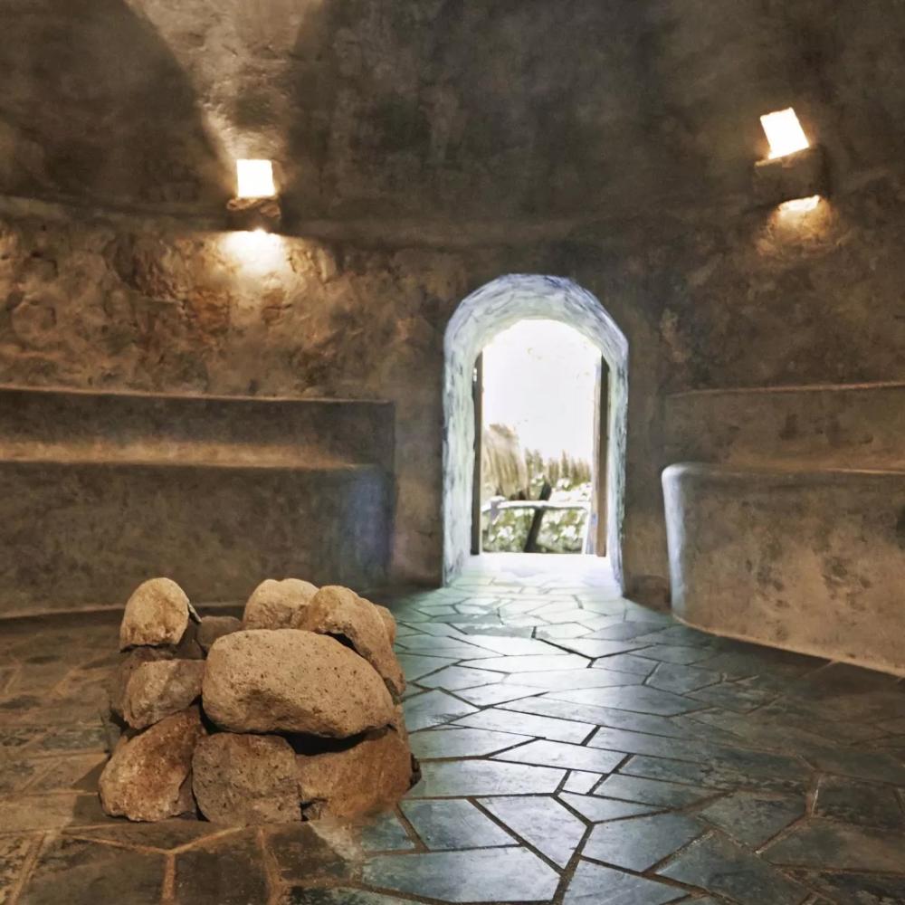 A carved stone relaxation space at the Sugar Beach spa