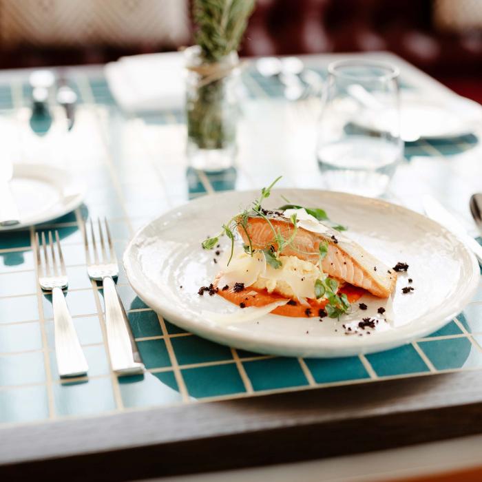 dinner plate of food sits on blue checkered table