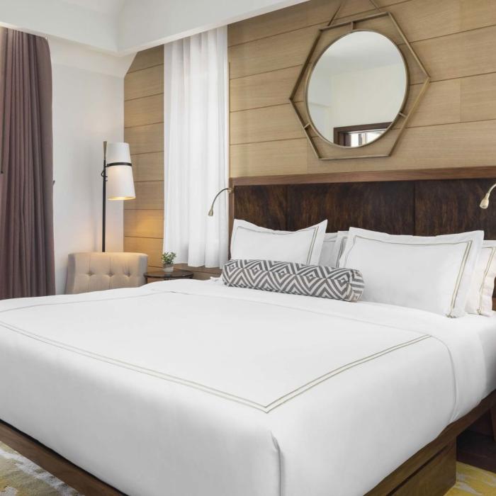 A king bed and balcony in a suite at Viceroy Kopaonik Serbia
