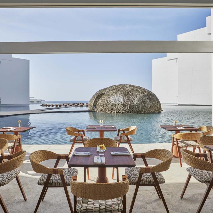 The outdoor patio overlooking a pool at Casero