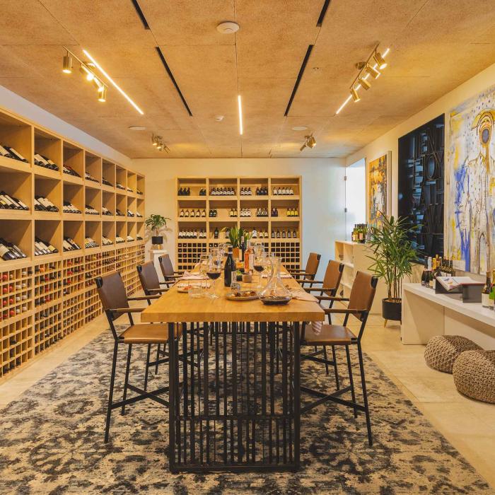 Viceroy Los Cabos' Wine Room, a bright cellar with floor-to-ceiling wine racks