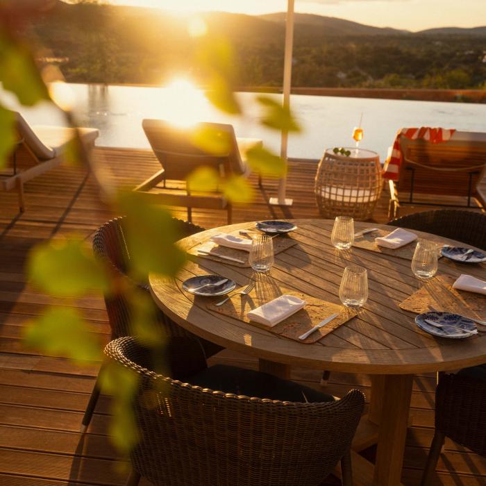 A patio table at Salpico at sunset