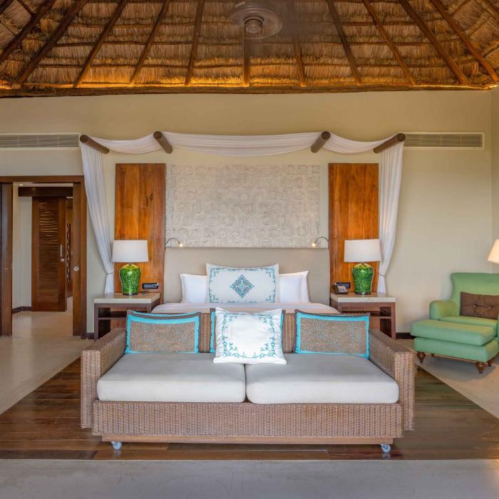 A Premium Villa bedroom with large bed at Viceroy Riviera Maya