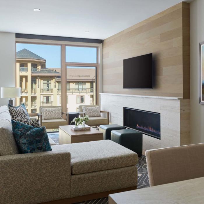 A well-appointed living room with a fireplace and a wall-mounted TV