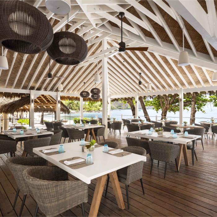 The outdoor restaurant Jalousie Grill, under a vaulted wooden roof