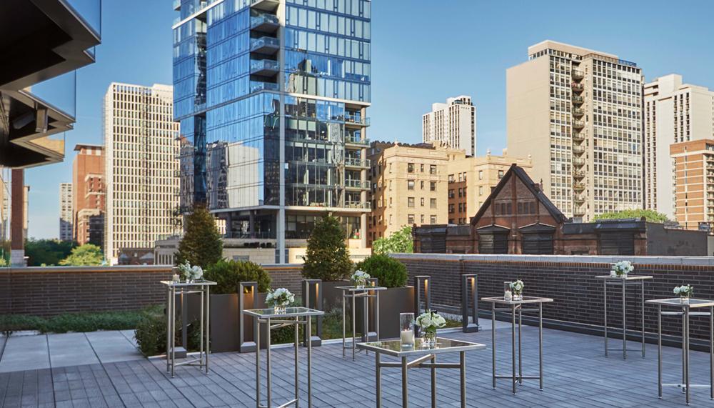 outdoor rooftop venue set with high square tables