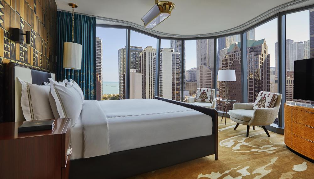 A suite at Viceroy Chicago with floor to ceiling windows and a beautiful view of Chicago 