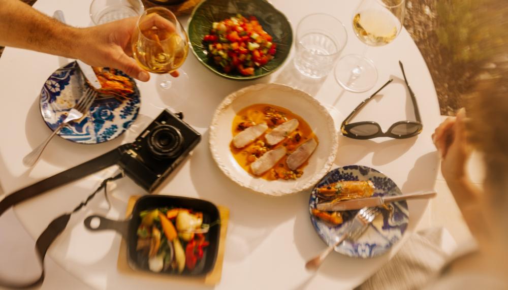 plates of food and personal items on table