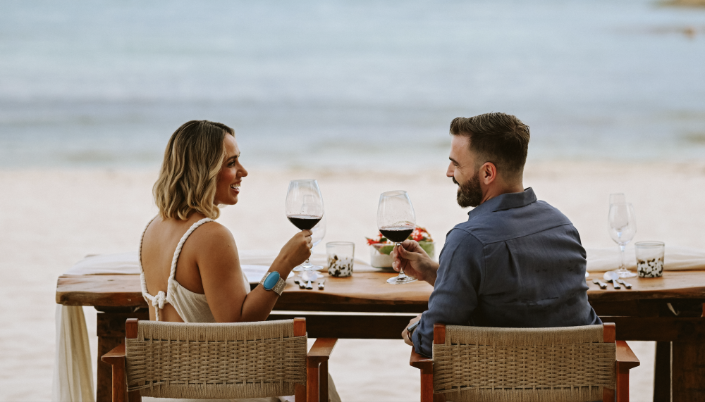 couple having dinner on beach