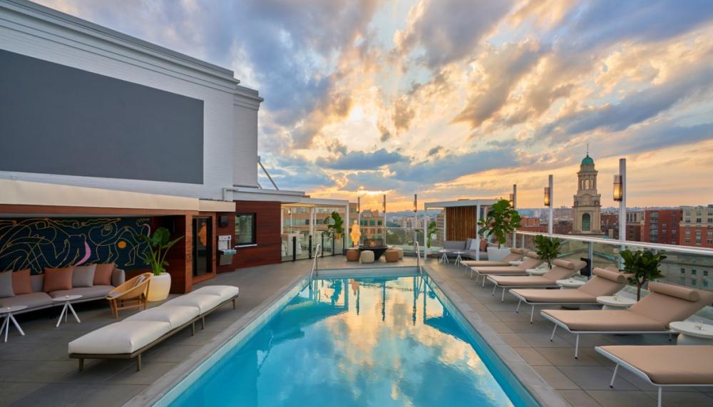image of Hedy's rooftop at hotel Zena with the sun peeping between clouds