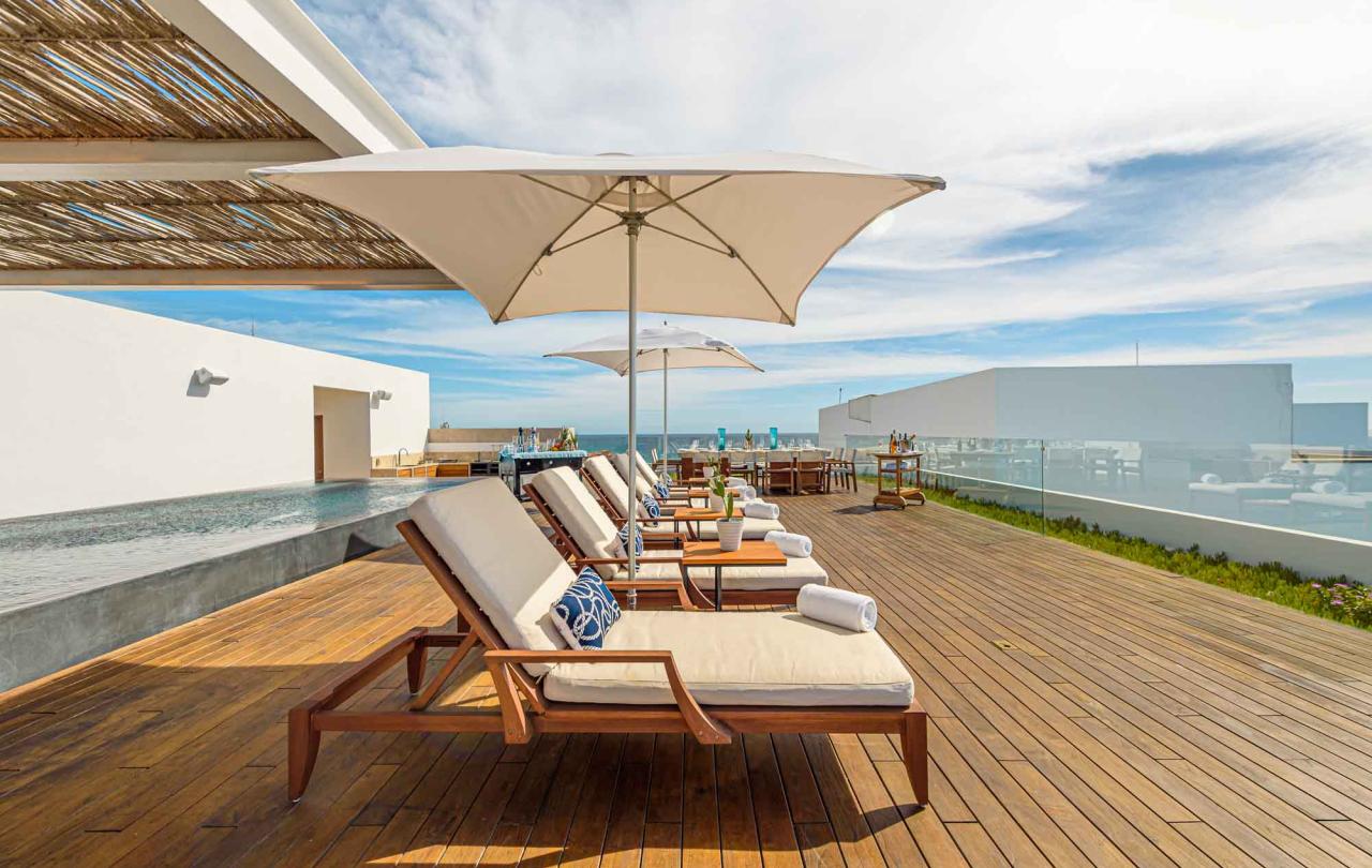 los cabos outdoor lounging chairs with umbrellas