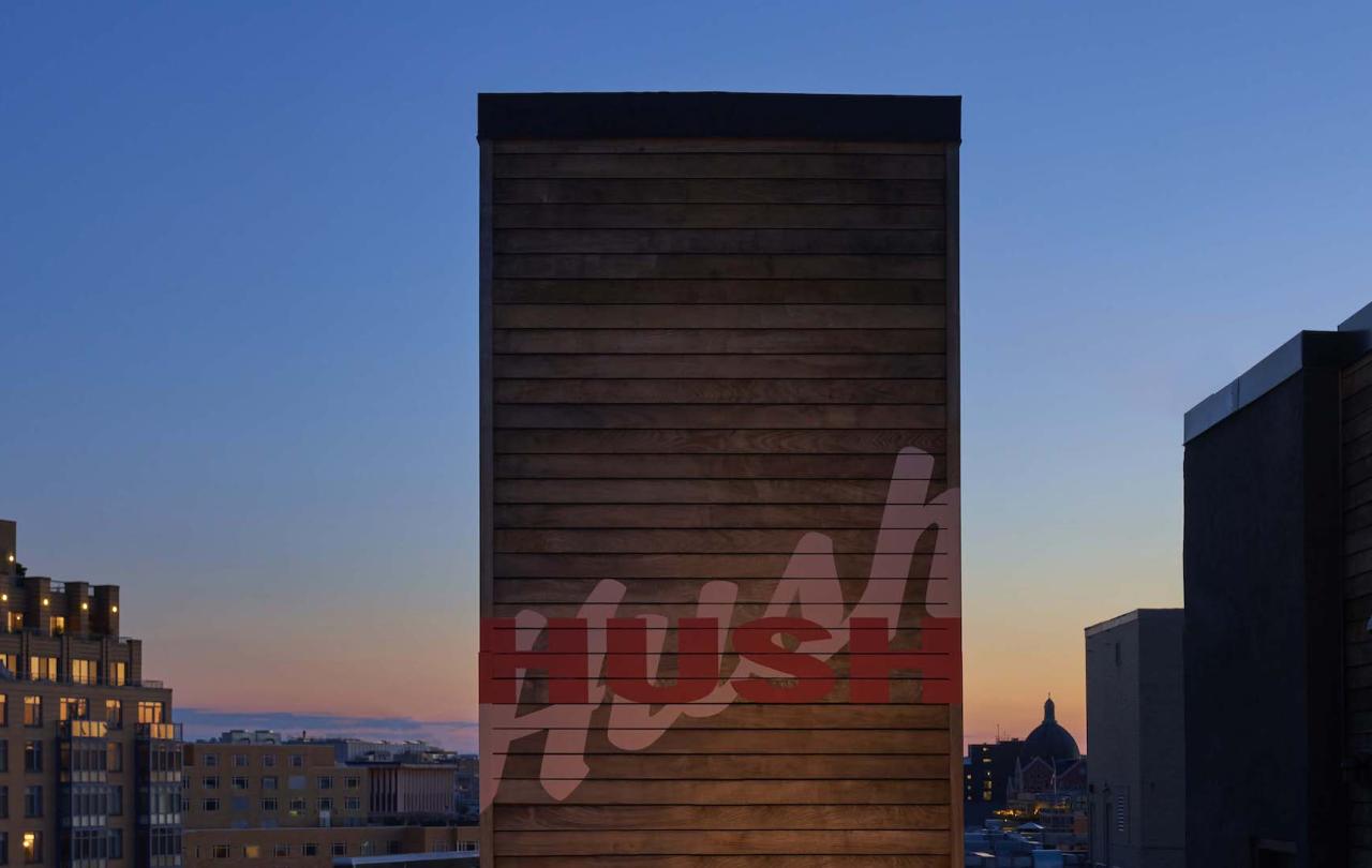 A wall with the words Hush written on it 