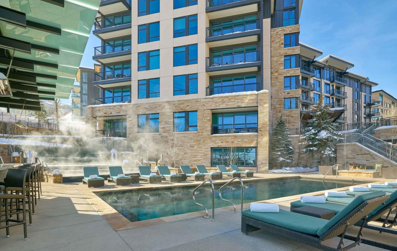 Viceroy Snowmass outdoor heated pool and lounge area