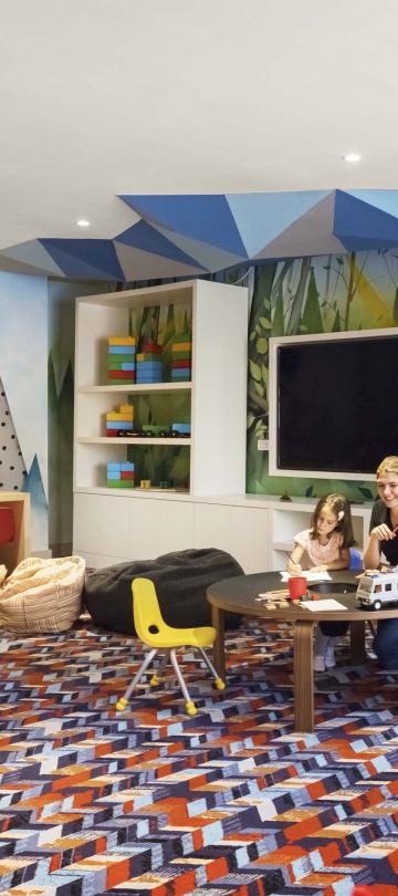 playroom with kids playing with toys