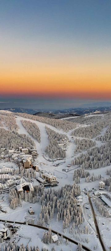 sunrise over snow covered mountains around Viceroy Kopaonik