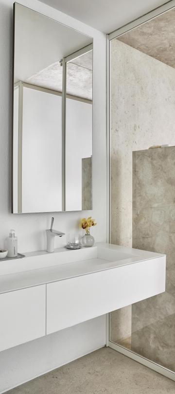 bathroom sink and shower in one bedroom suite