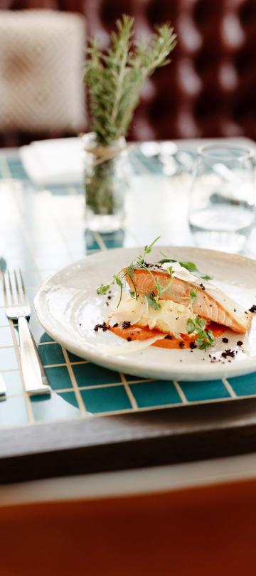 dinner plate of food sits on blue checkered table