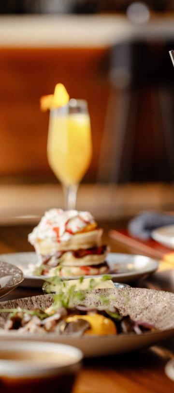 brunch dishes and cocktails on table