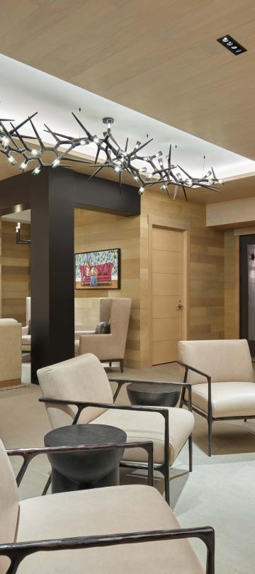seating area around fireplace with photo collage on wall