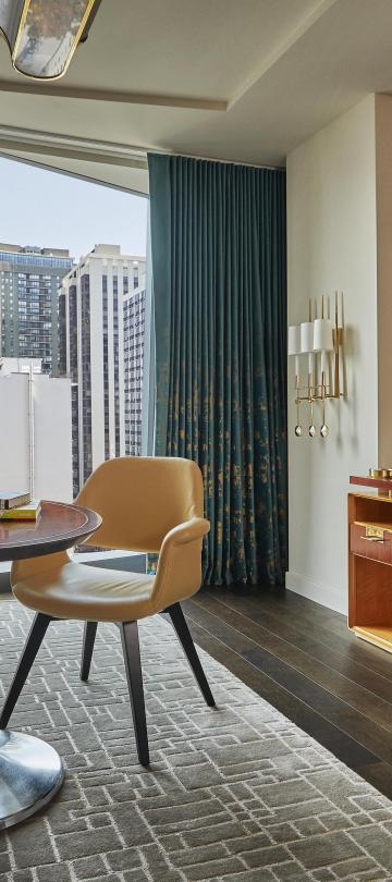 Living room with desk and view of the city