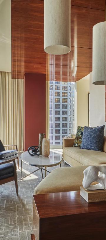 Large living room area with floor to ceiling windows