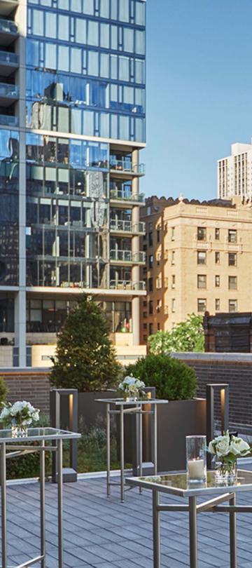 outdoor rooftop venue set with high square tables