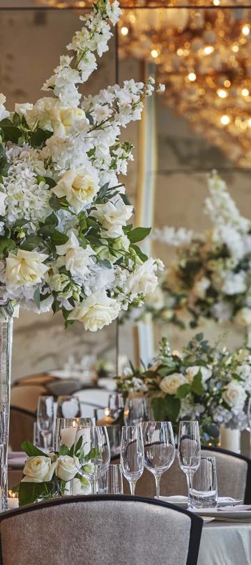 large floral centerpiece on a round table