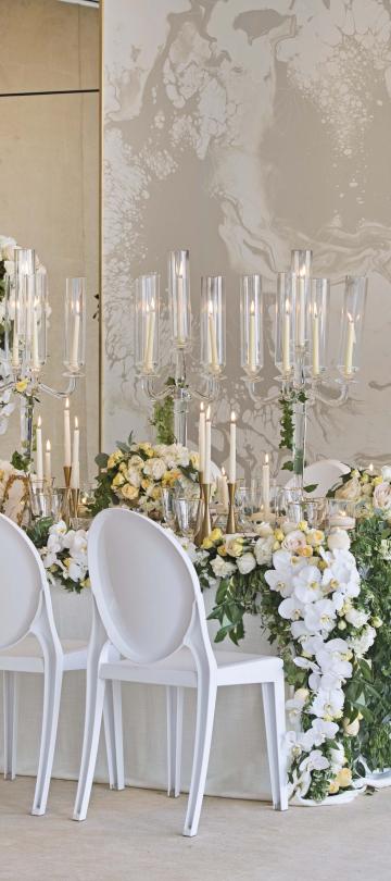 Indoor venue decorated for a wedding reception