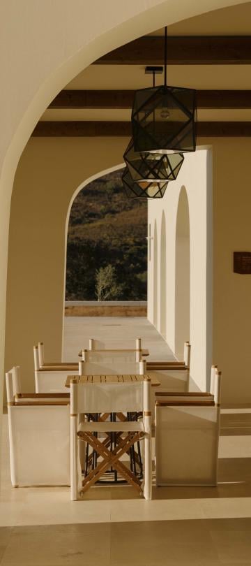 covered outdoor dining area with long table