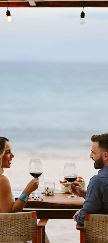 A couple enjoying dinner on the beach