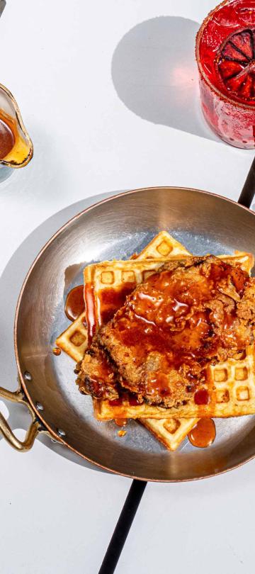 chicken and waffles in a small frying pan