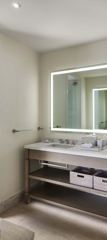 Bathroom with a double vanity and stand up shower