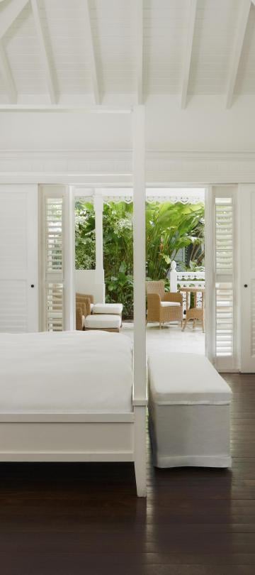 Bedroom with large bed and sofa