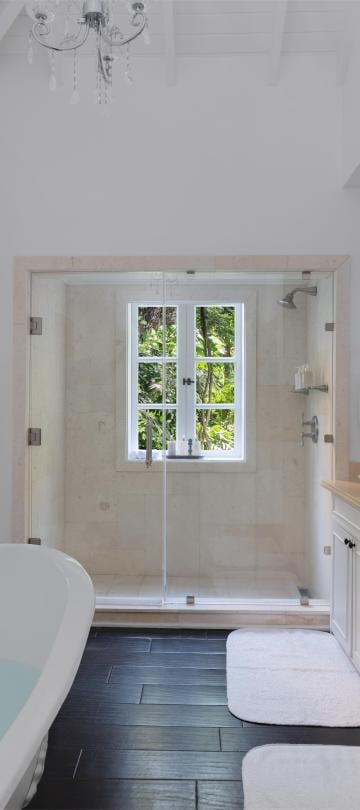 bathroom with claw tub and shower