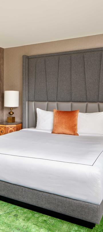 bedroom with king bed and green carpet