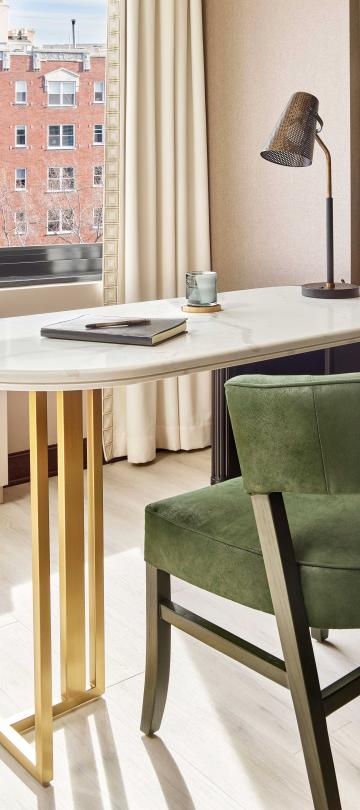 Small desk with a suede green chair